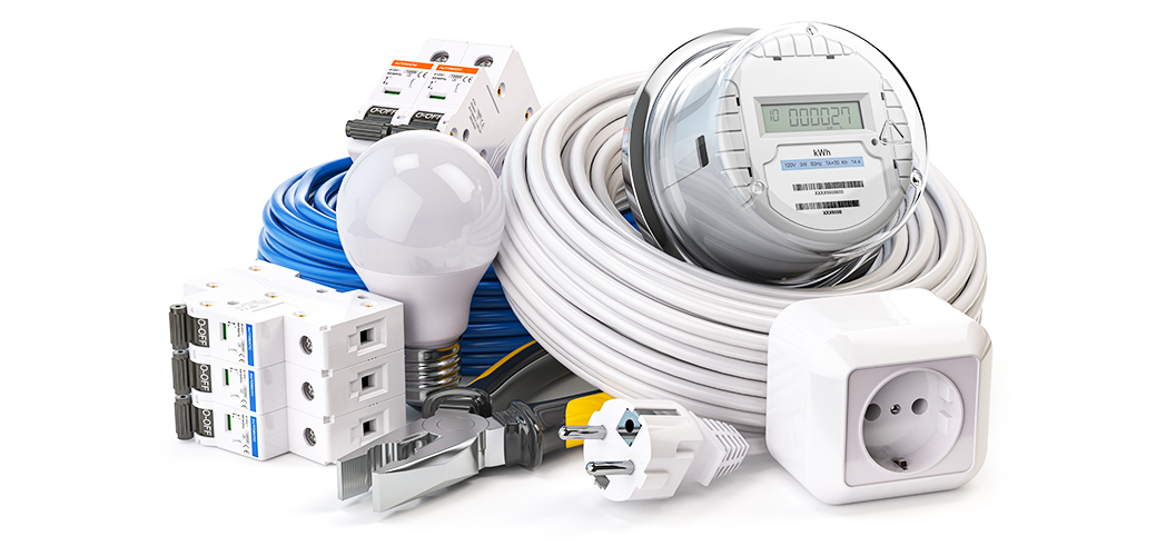 Clean workshop filled with colorful electrical cables, switches, and glowing light bulbs arranged on shelves